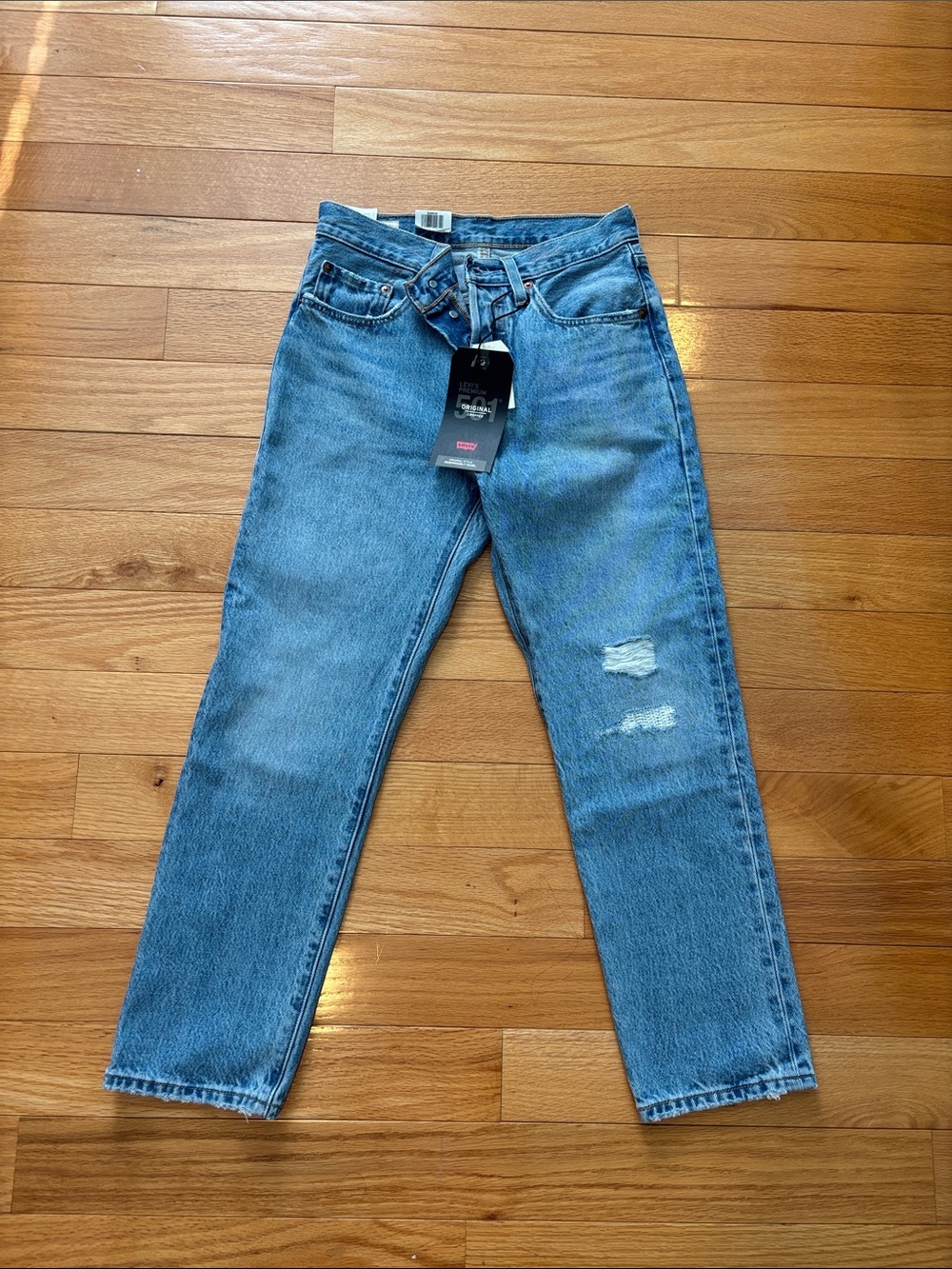 Levi's Light Blue Straight Women’s Jeans with Distressed Detail
